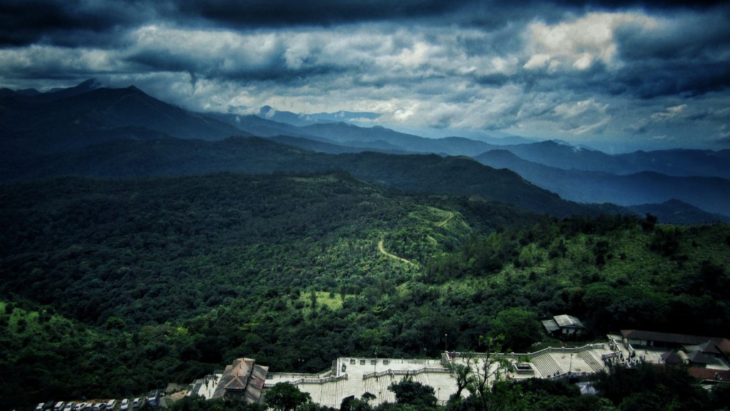 Scenic view of mountains and lush forest from a high vantage point in Kodagu