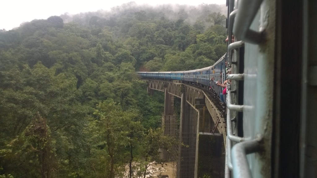 train running through a railway bridge in Sakleshpura